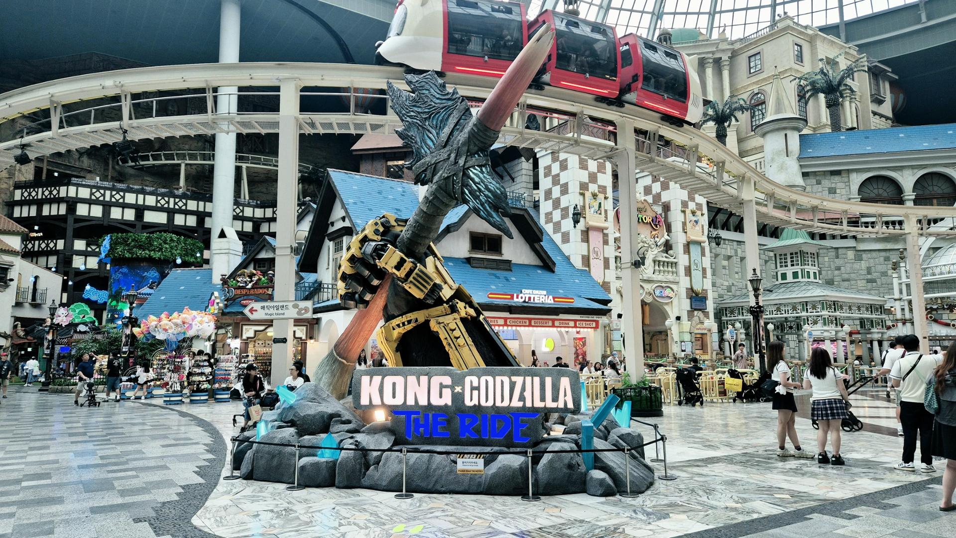 A photo zone displaying animatronic figures from Kong X Godzilla: The Ride