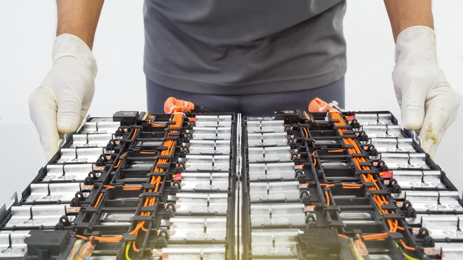 Battery technician working on EV cells