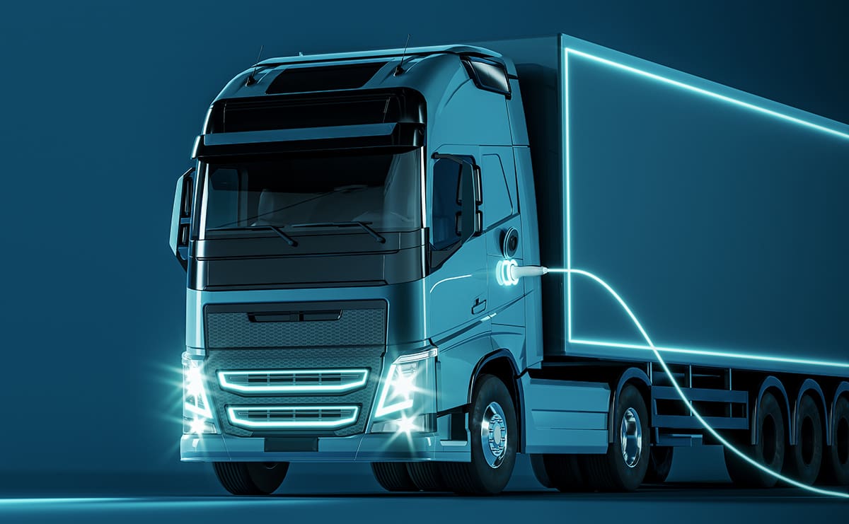 An electric semi truck on a highway.