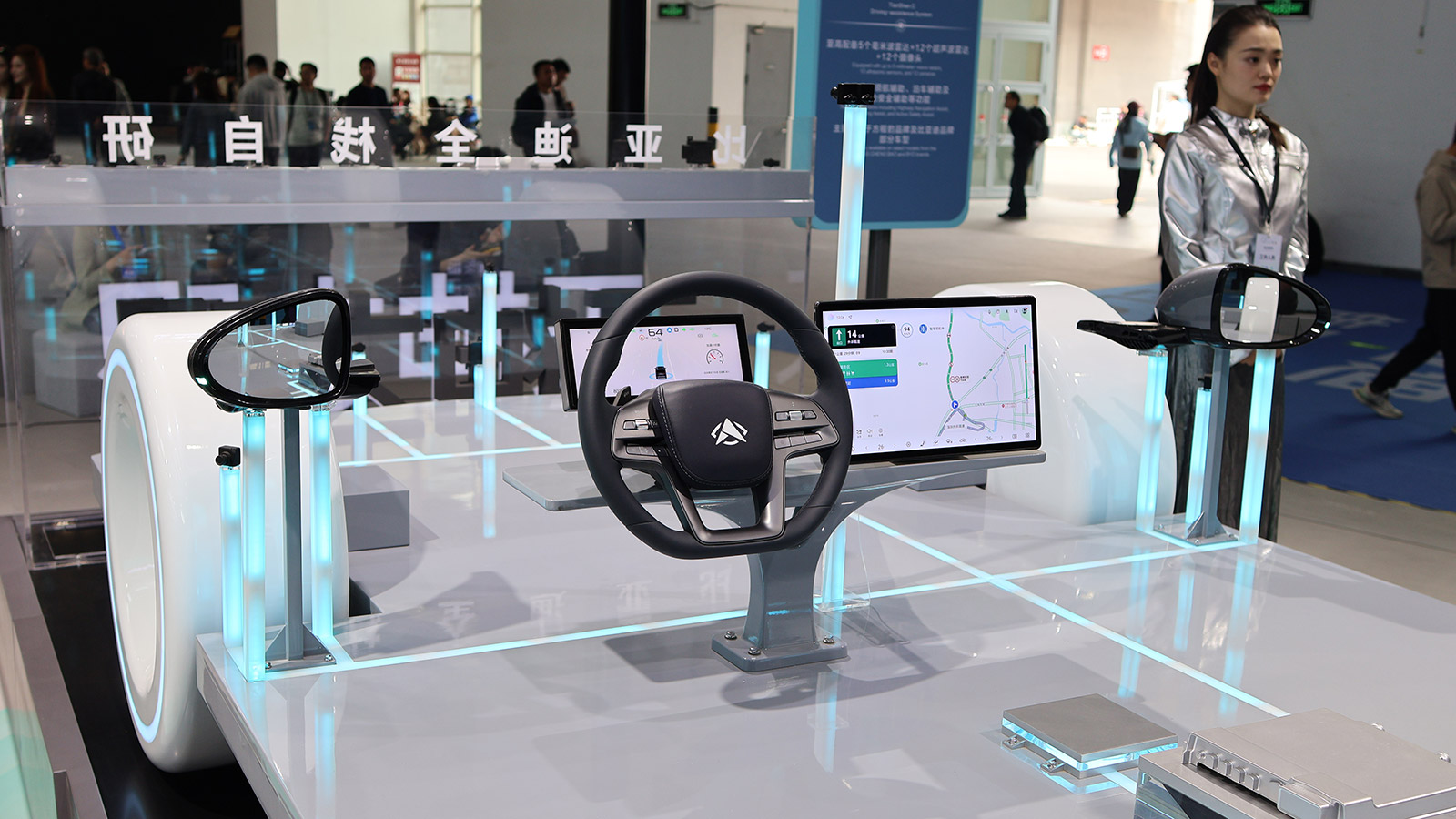 A BYD autonomous driving prototype with an exposed steering wheel, displays and sensors on display at the 2026 Beijing Auto Show.