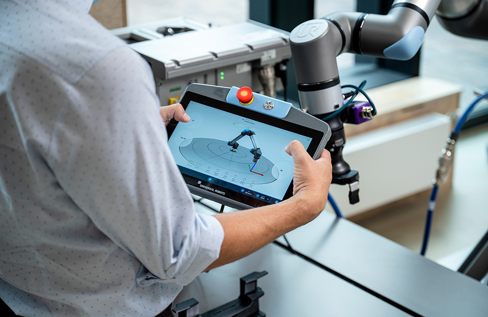 Universal Robots Gen 7 collaborative robot arm with the new tool flange, controller and teach pendant